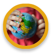 Hands holding a world globe like a ball