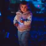 Child holds flashlight