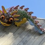 Large colorful sculpture of an axolotl alebrije.