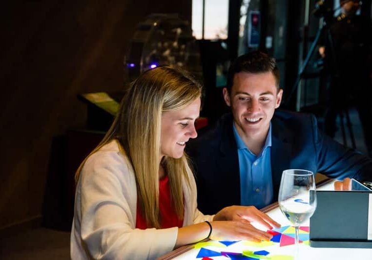 Young professionals play with light table.