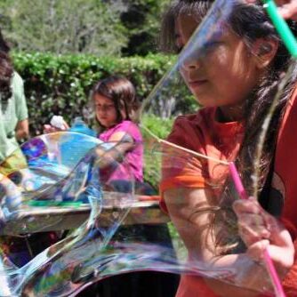 Kids playing with bubbles